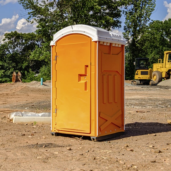 what is the cost difference between standard and deluxe portable restroom rentals in Veyo